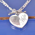 fingerprint necklace, a heart engraved with a print on a t bar chain.