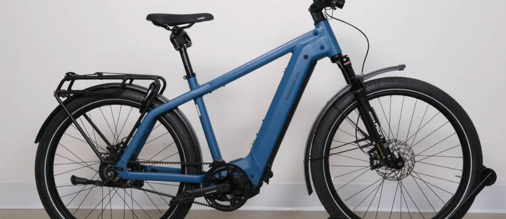 a blue Riese & Müller Charger4 GT Vario electric city bike