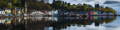 Logo de la distillerie Tobermory avec une vue sur baie et le village de Tobermory sur l'île de Mull dans les Hébrides intérieures d'Ecosse