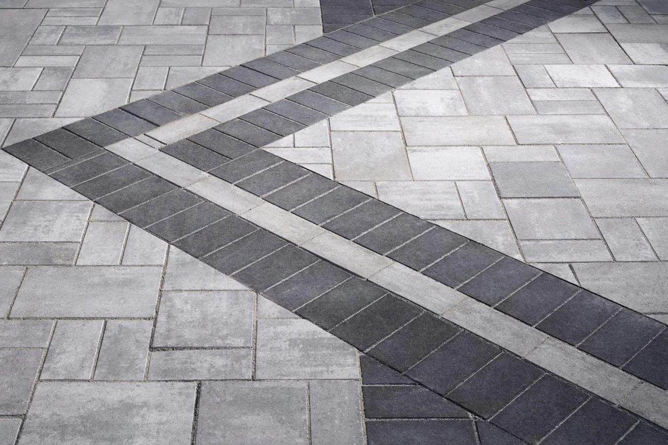 Unique triple border made with Charcoal Holland Pavers and Foundry Holland pavers