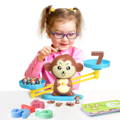 A girl playing with the Montessori Monkey's Math toy. 