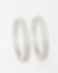 Intricately designed silver bangles with circular diamond patterns displayed on a white background.