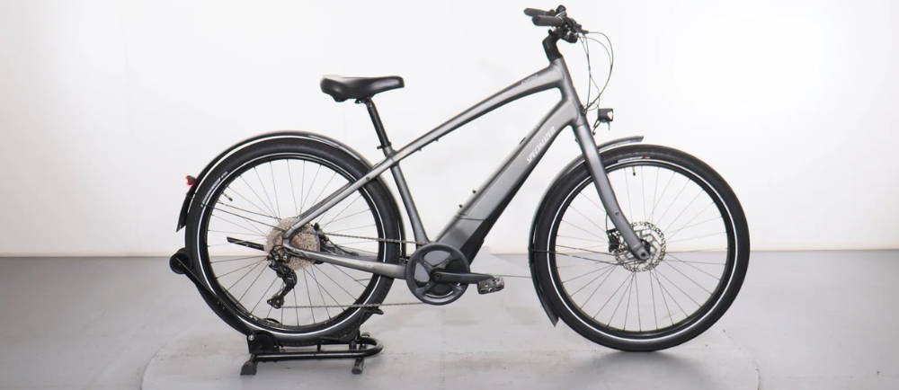 a silver specialized electric city bike
