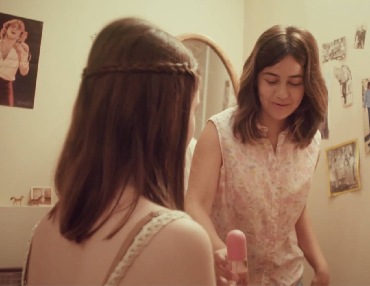 Two teenage girls; one holding a Love's Baby Soft bottle.