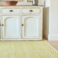 yellow summerhouse rug with cupboard unit