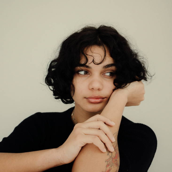 woman with dark hair in a bob haircut