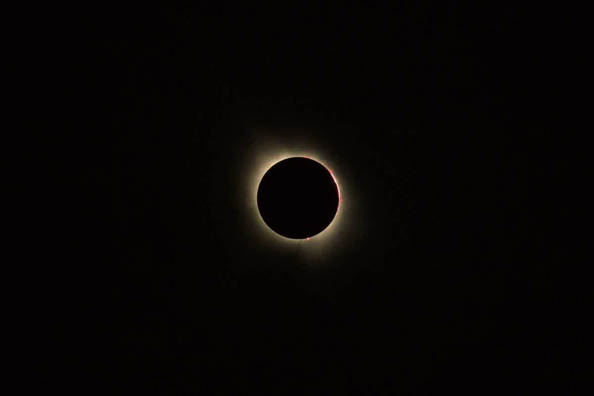 Totality with visible red prominences