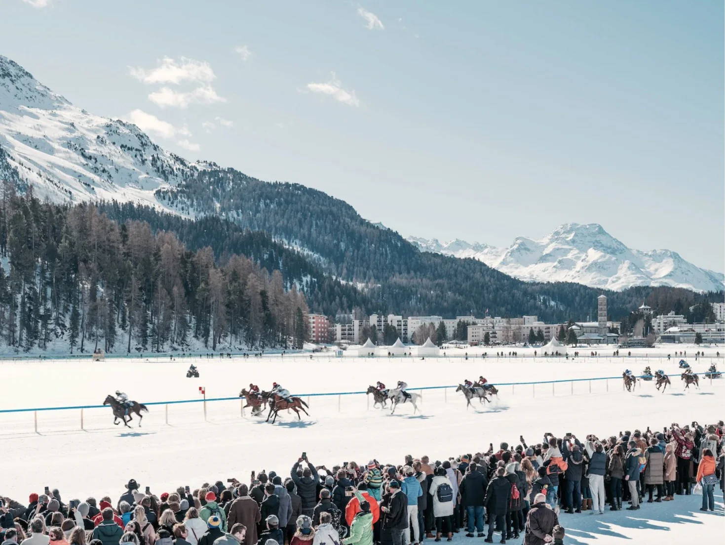 White Turf by Stuart Cantor - A photographic print capturing horses racing in the snow amongst the mountains of St Moritz.