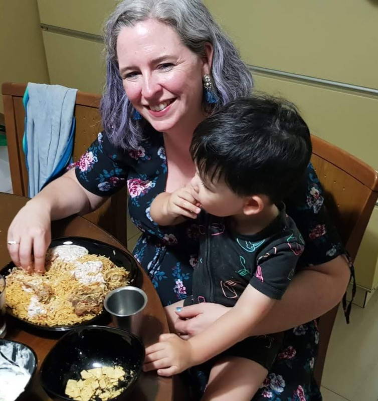 eating biryani with hand baby and mum 