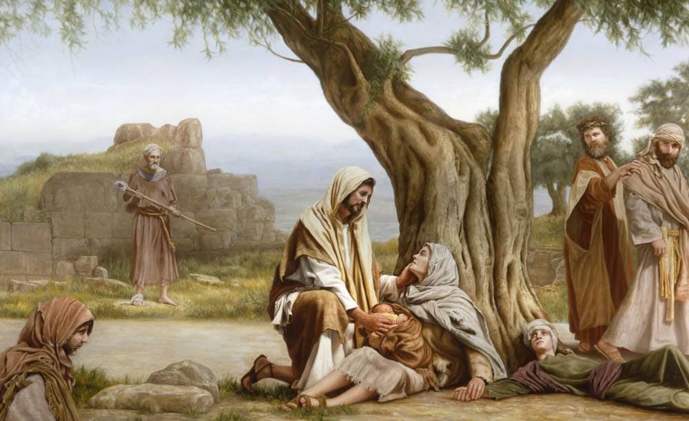Jesus healing an ill person sitting against a tree.