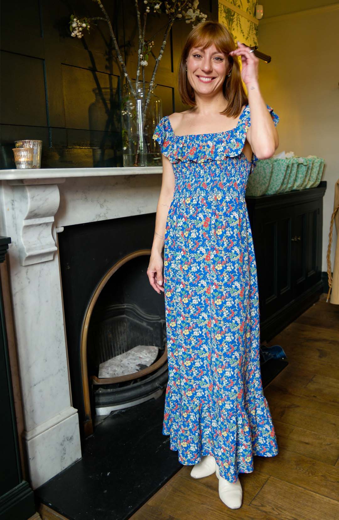 Writer Katherine Ormerod wears Yolke's Blue Off The Shoulder Bardot Dress