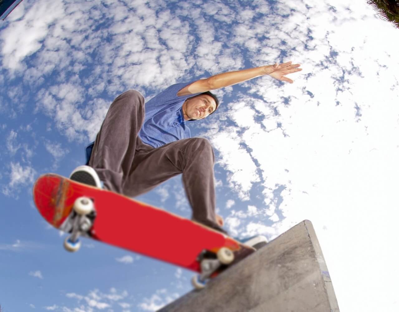 Joey doing a trick on a skateboard