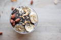 healthy breakfast bowl with chia seeds, banana and walnuts 