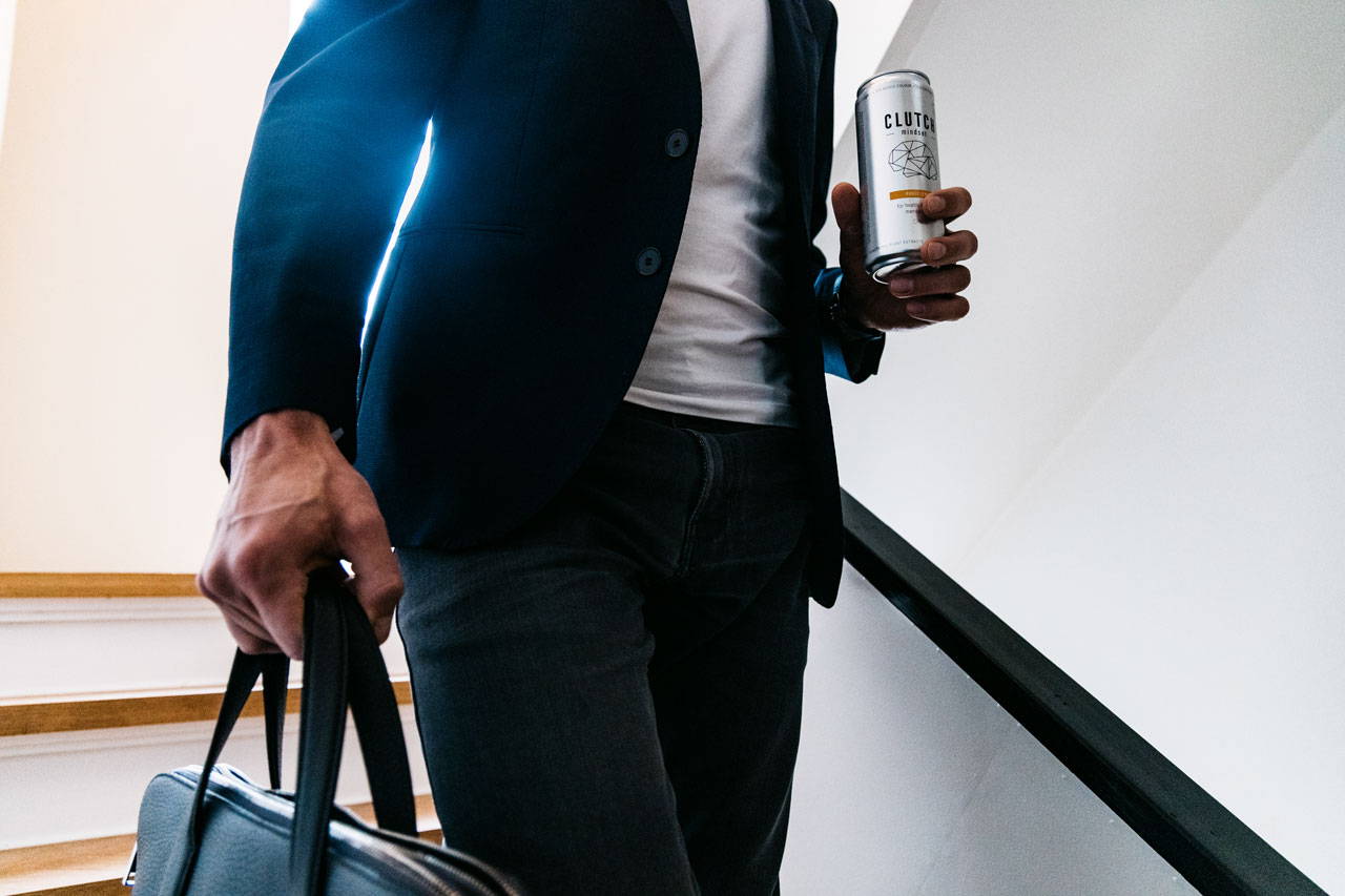 Busy business man holding a Clutch
