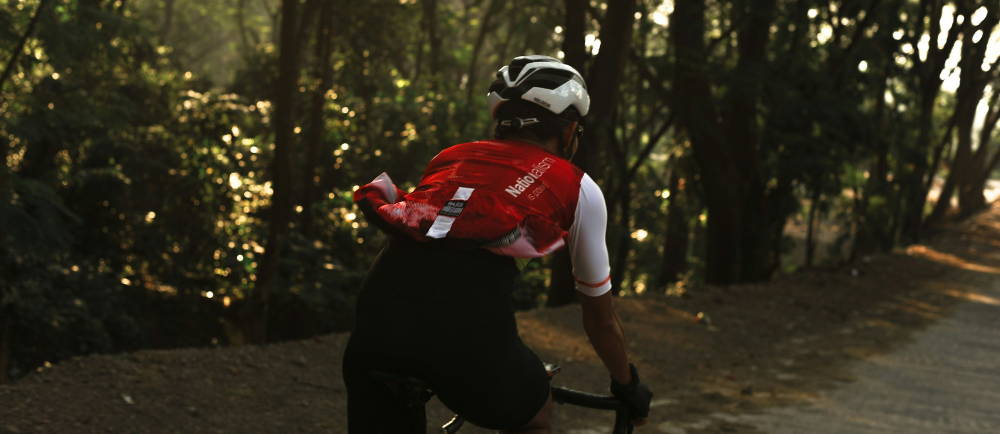 Cyclist with jersey riding on trail
