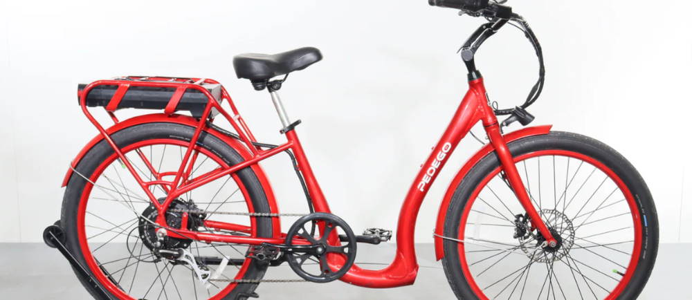 a red Pedego Boomerang electric city bike