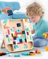 Little boy sitting next to a Montessori Tetris and placing pieces into the wooden Tetris board. 