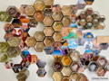 A collection of hexagonal glass jars and pictures cut in a hexagonal shape styled on a wall
