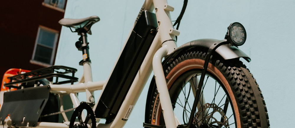 a white specialized Globe Haul electric cargo bike
