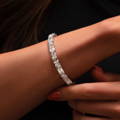 Emerald-Cut and Round Diamond Bracelet on woman's wrist