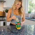 female-placing-cash-inside-diversion-safe-canned-corn female-placing-cash-inside-diversion-safe-canned-corn