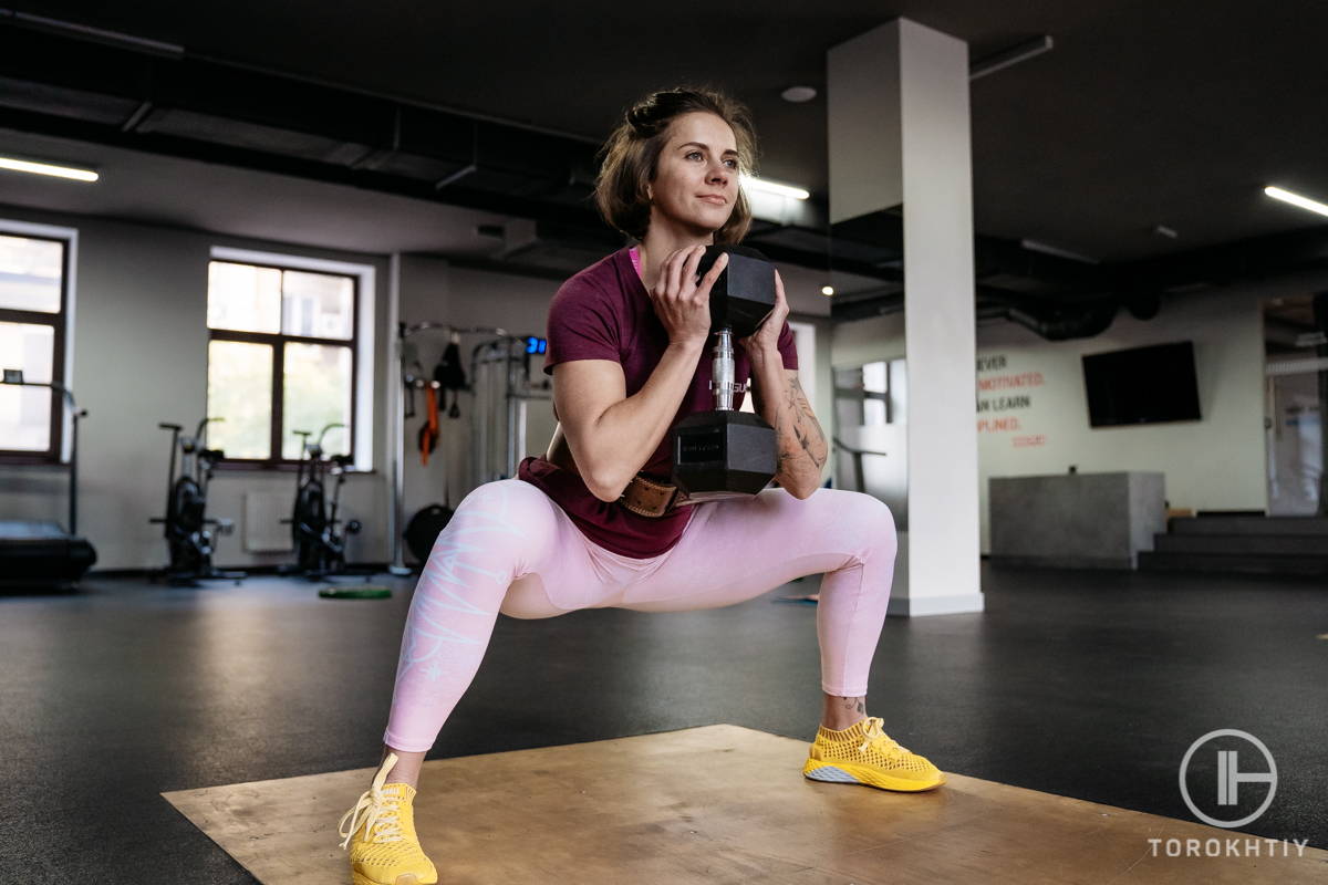 female athlete squatting