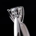 Close-up of a mounted diamond in an engagement ring setting