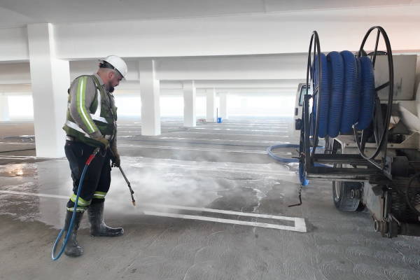Graffiti removal from Stained Concrete Bike Path Grating