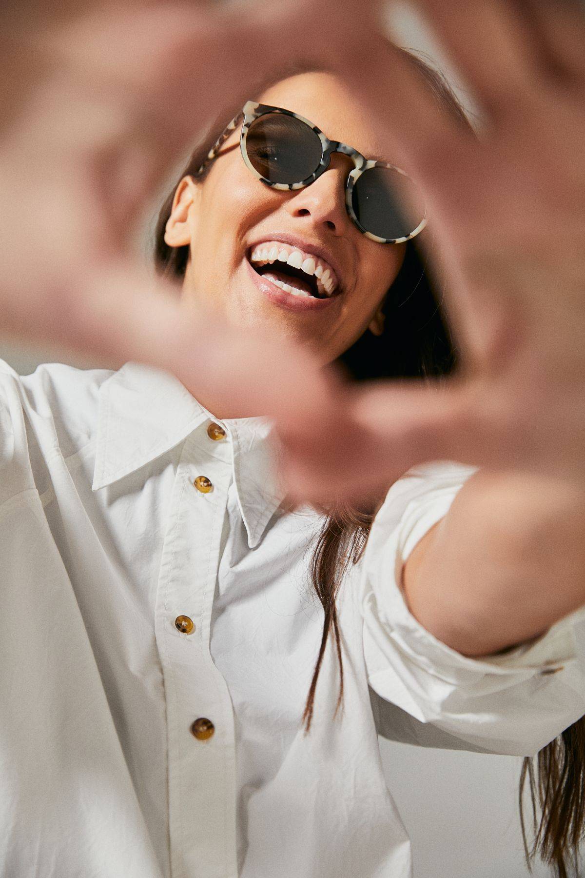 Female model wearing Ozeano polarised sunglasses