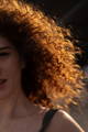 woman with uneven skin looking at the sun