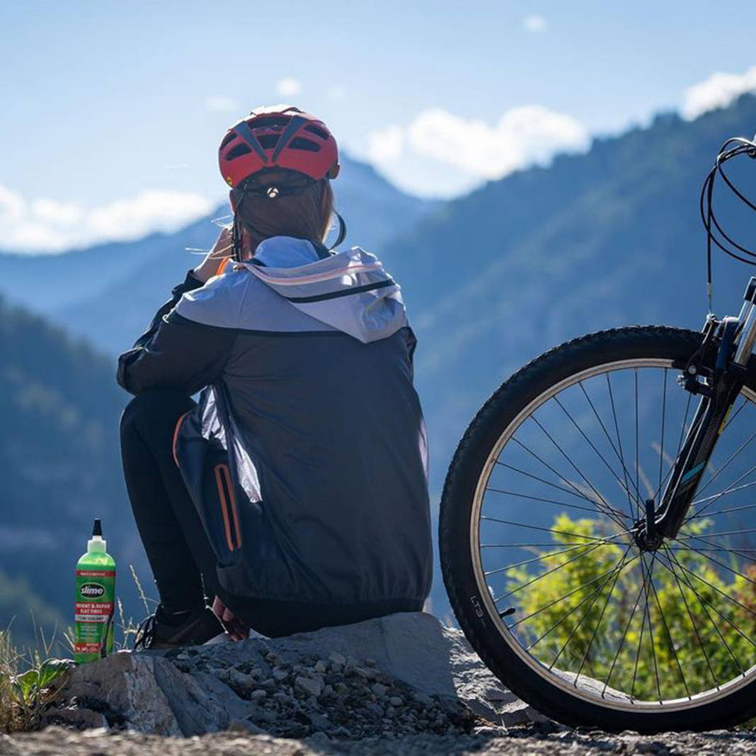 Mountain Bicyclist on Mountain with Slime Tube Sealant