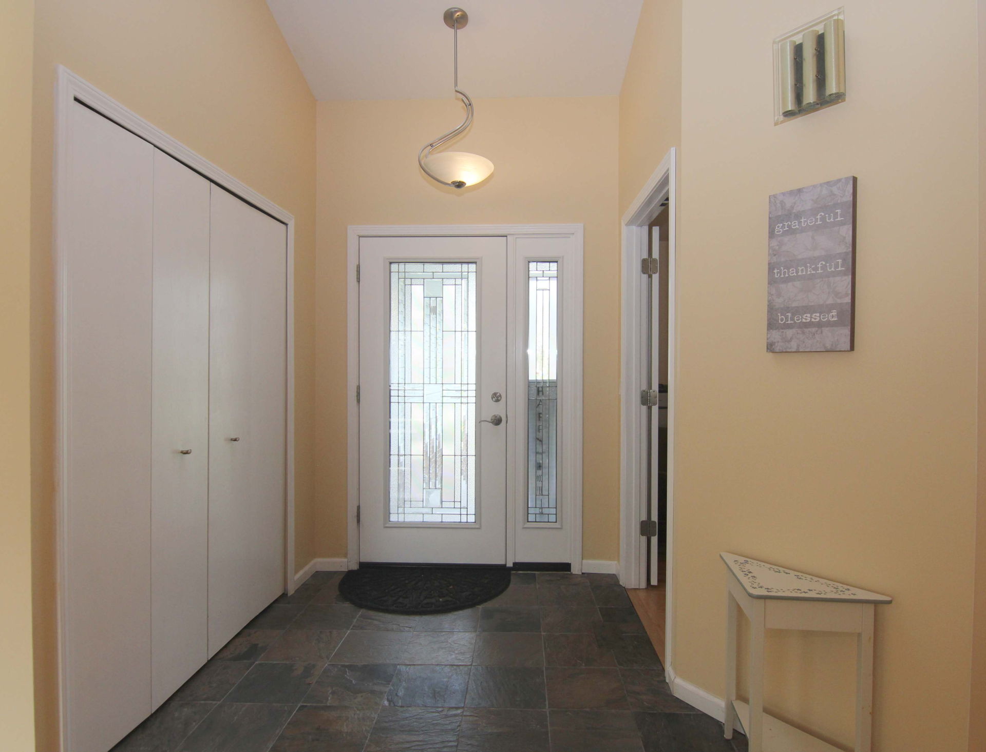 foyer featuring tile floors and natural light