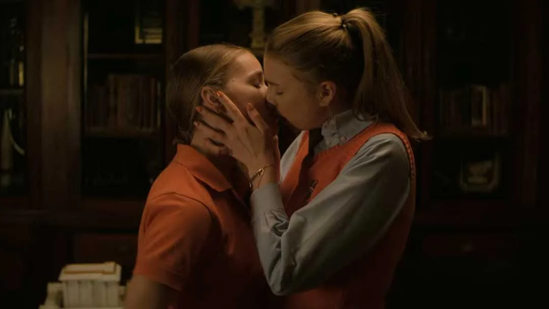 April and Sterling kiss in a room alone.
