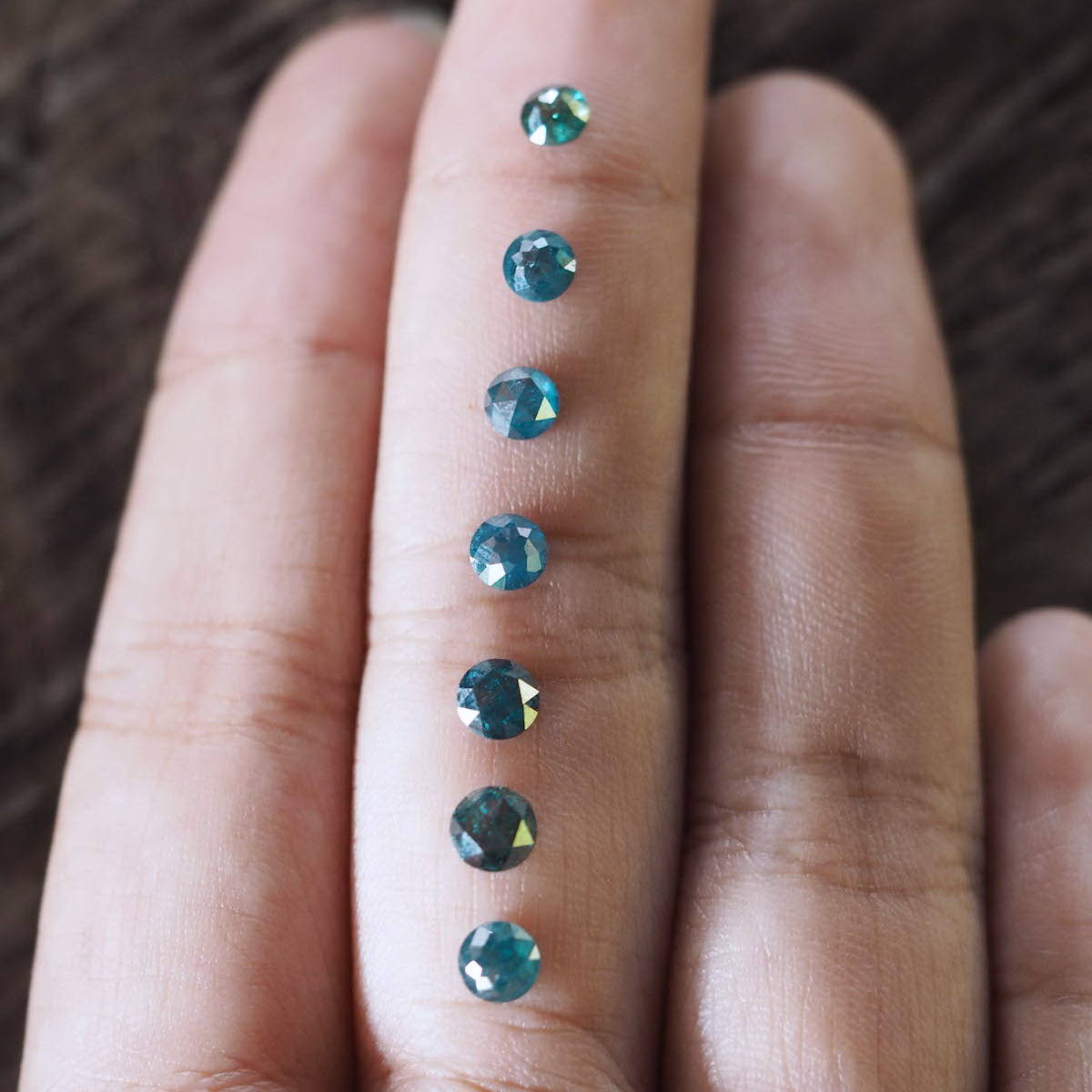 Round blue diamonds that have been irradiated for color