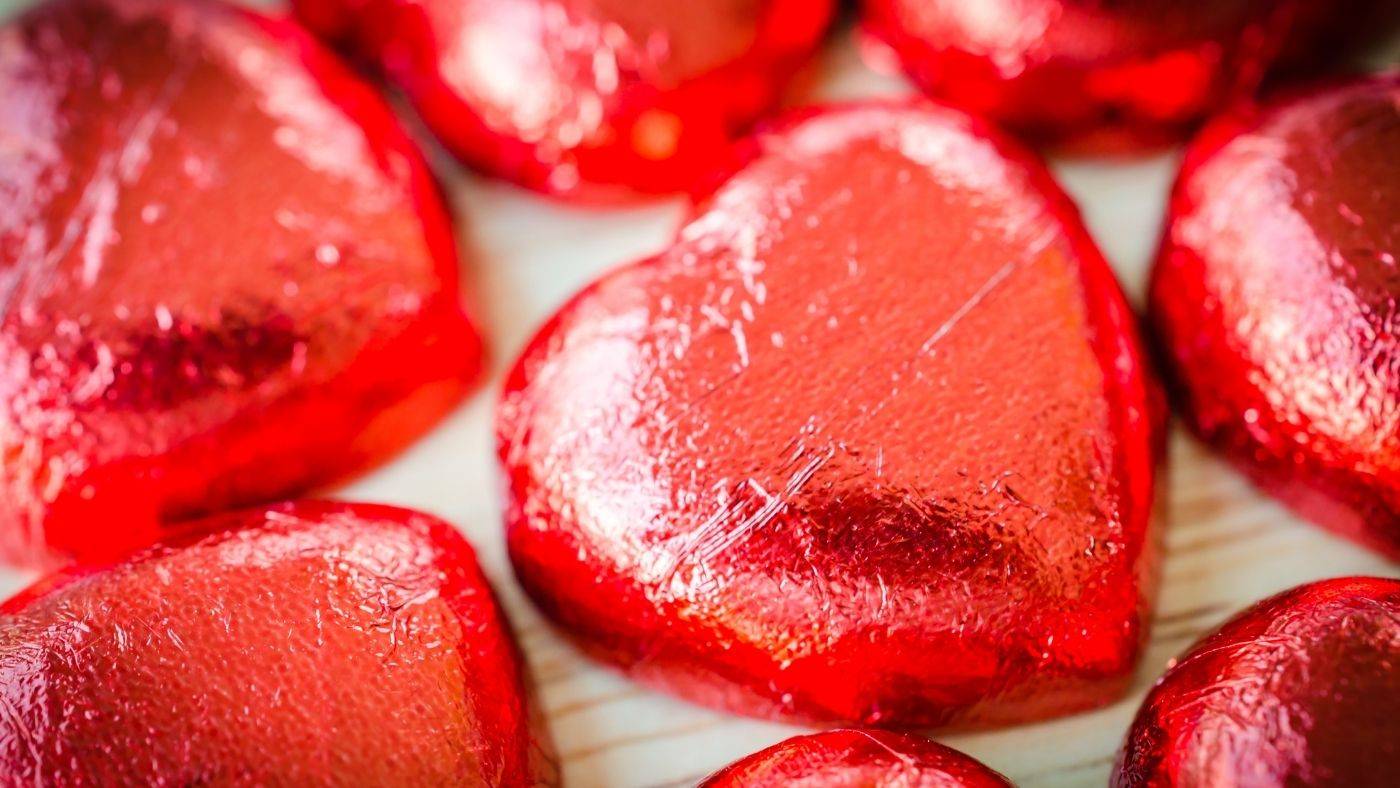 Small chocolate hearts wrapped in red foil