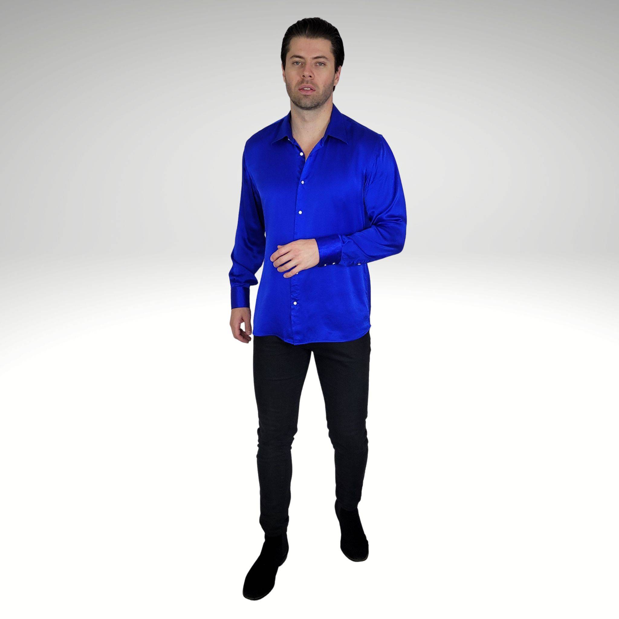 photo of a model wearing a long sleeve blue silk dress shirt untucked with skinny black jeans and black chelsea boots