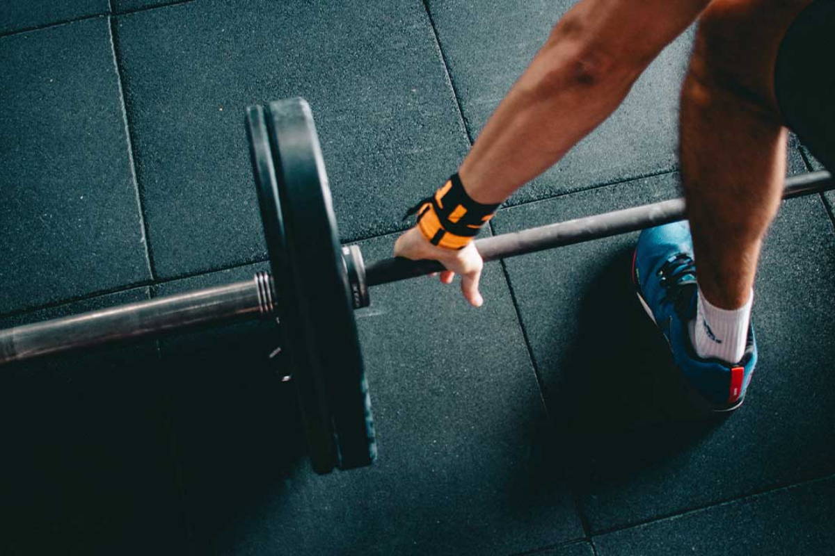 athlete ready to start training on gym flooring