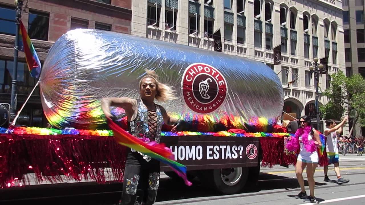 During pride a large burrito float from a corporate business with people marching alongside it.