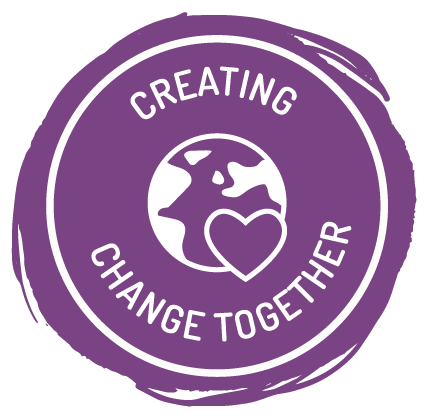 Image of a circular, purple Ducky Zebra icon with the text: "Creating change together"