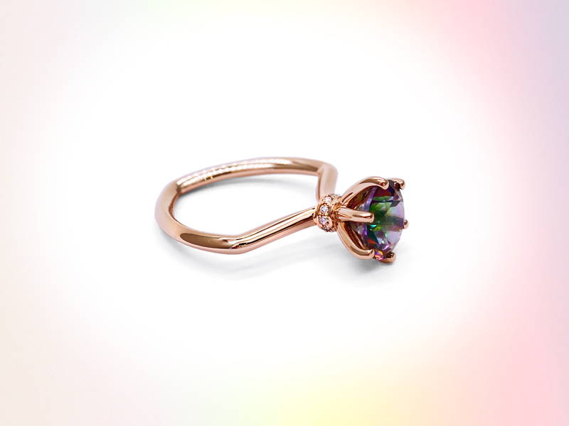 Hexagonal rose gold ring body with mystical topaz set on claws