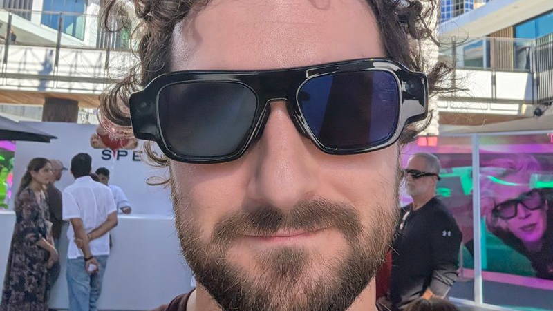 Boone Ashworth wearing black snap specs looking at camera