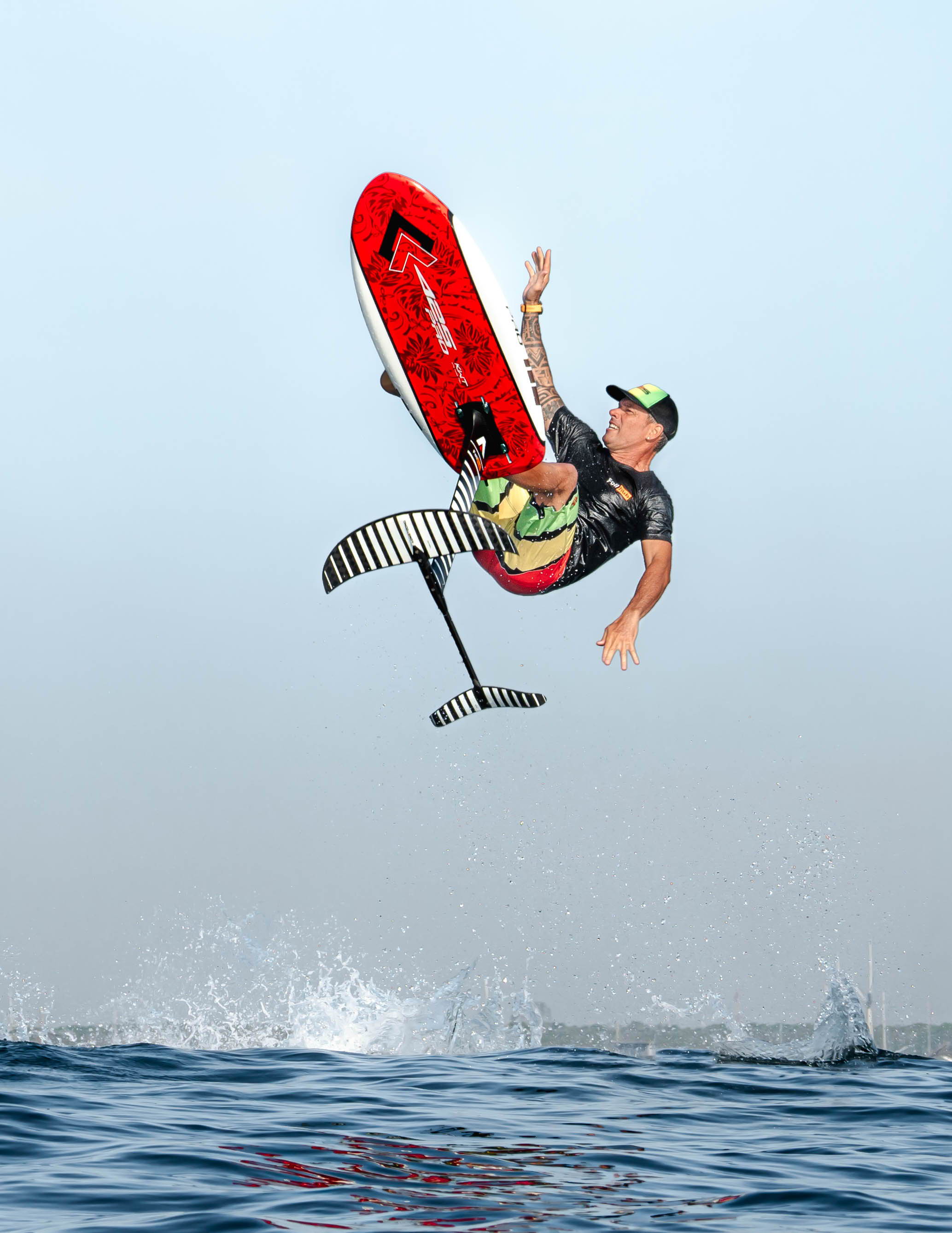 425pro board in action: a man jumping in the air from the blue sea water 