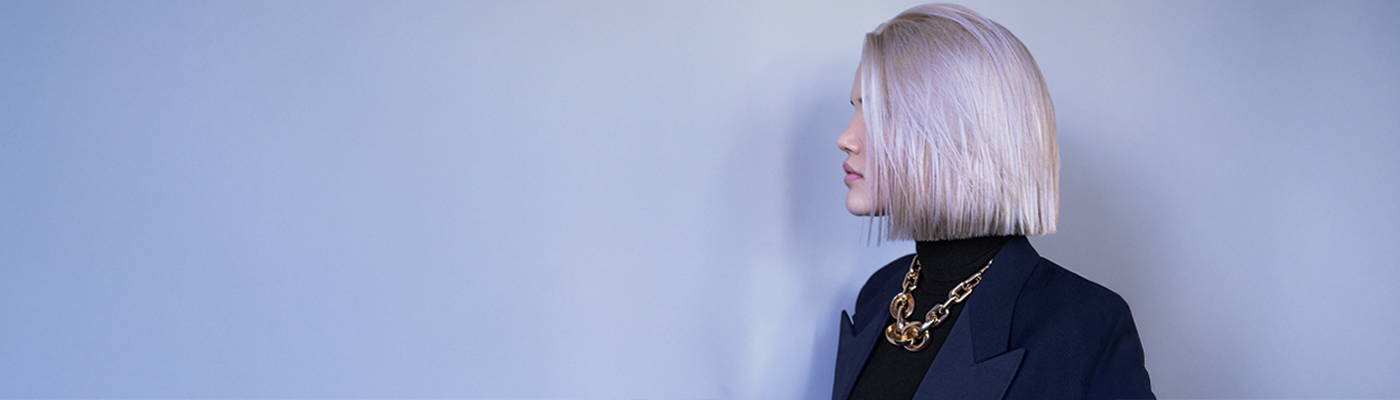 Davines model with platinum blonde hair in a french bob haircut