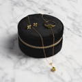 The 2025 Solid Gold August Capsule, peridot ring earring and necklace with free black weekender jewelry case