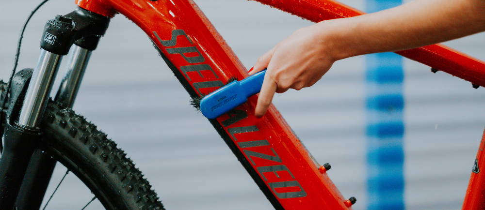 cleaning off the frame of a Specialized electric MTB