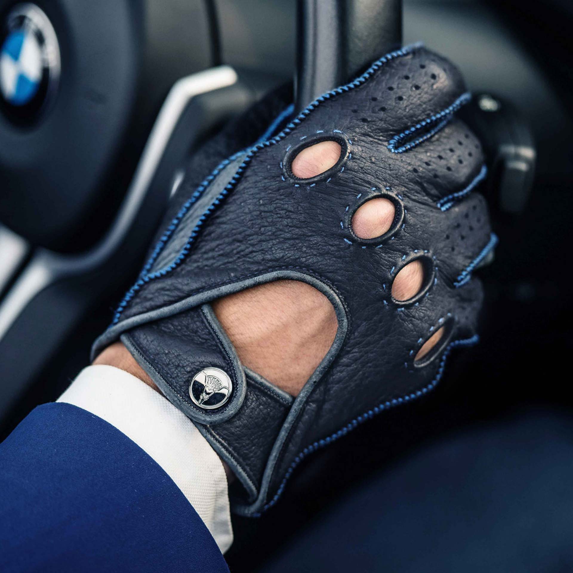 Blue leather driving gloves