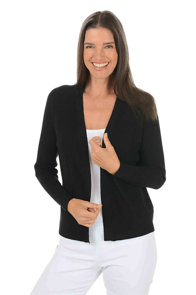 A woman wears a black cable knit cardigan.