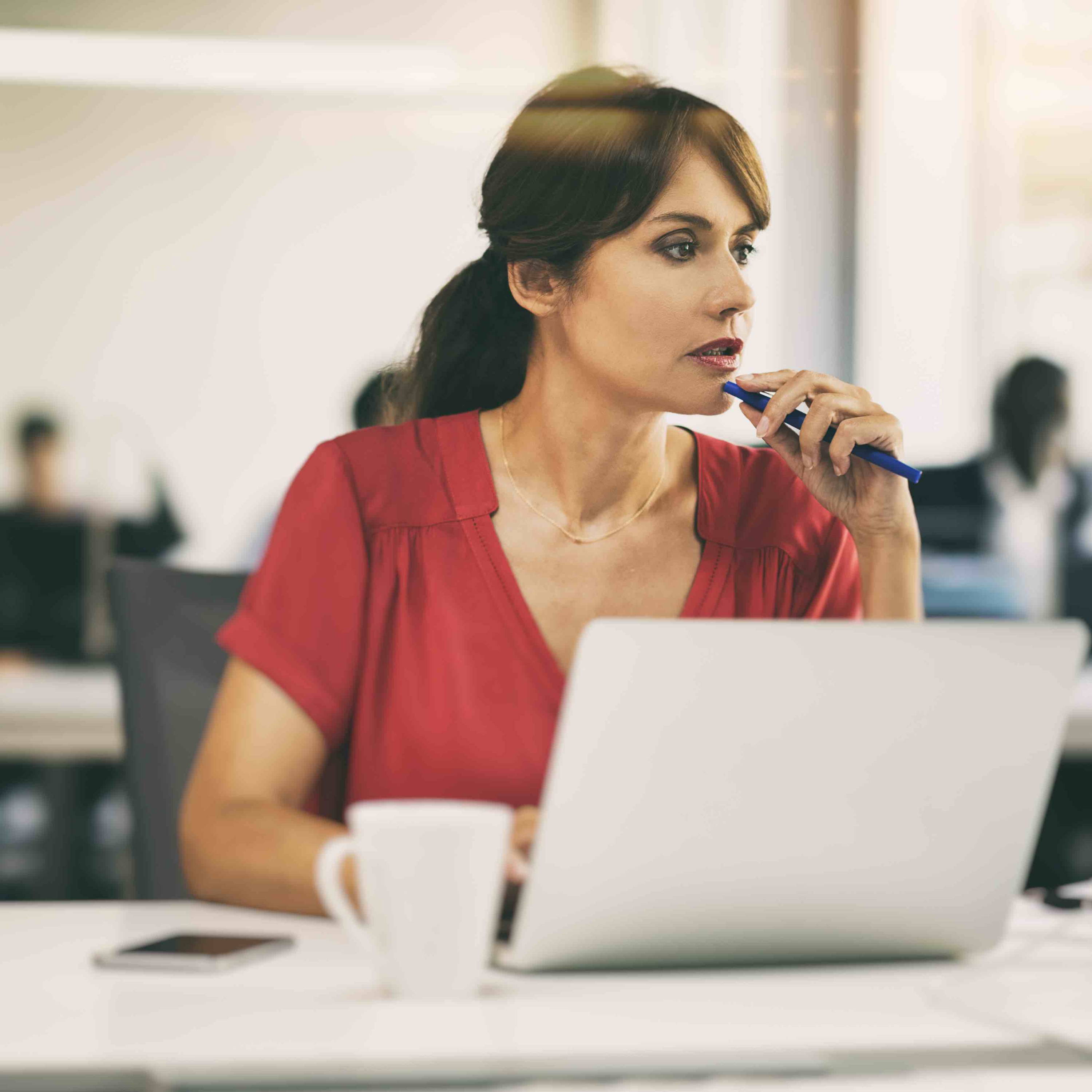 Woman sitting with computer at work