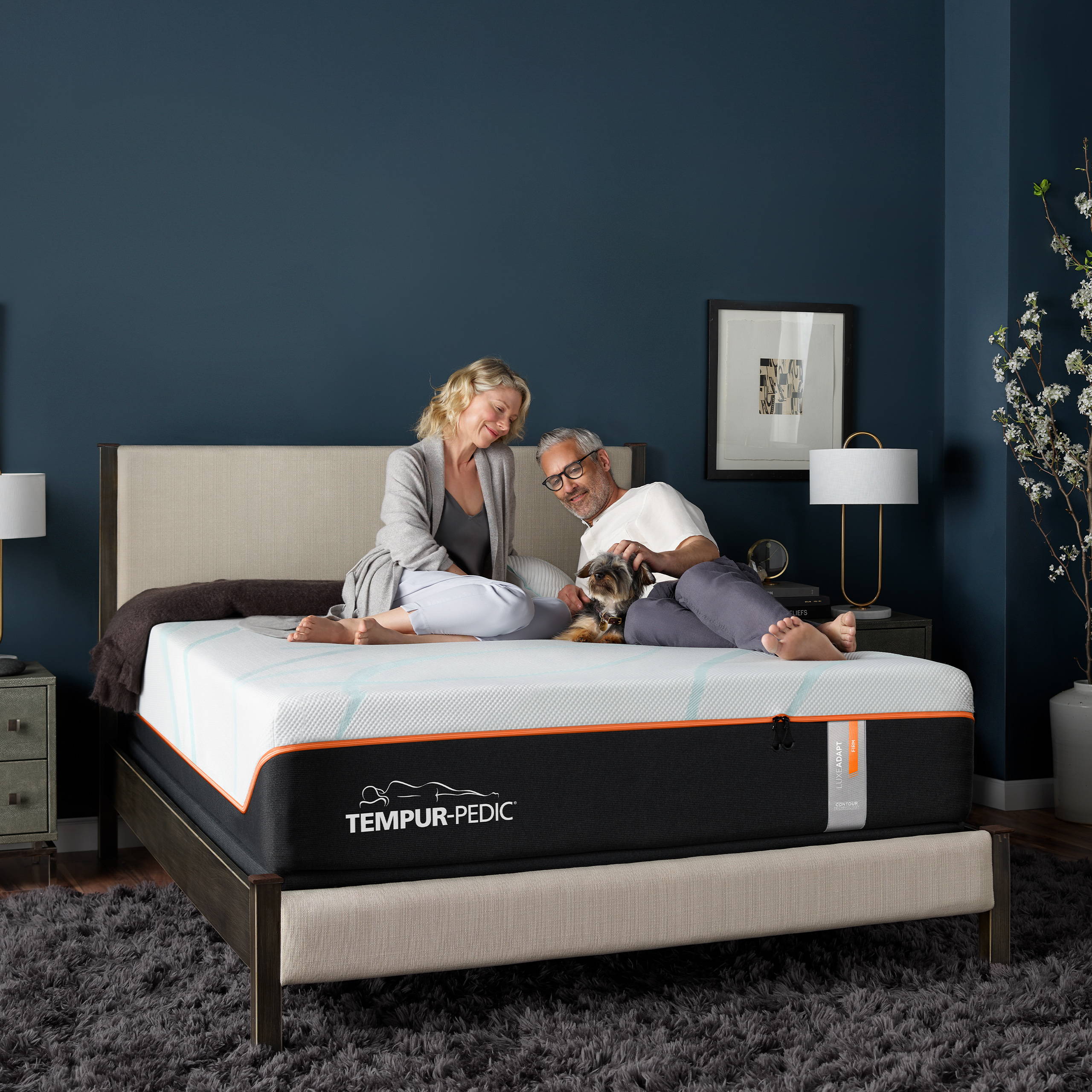 Couple laying on luxe adapt mattress