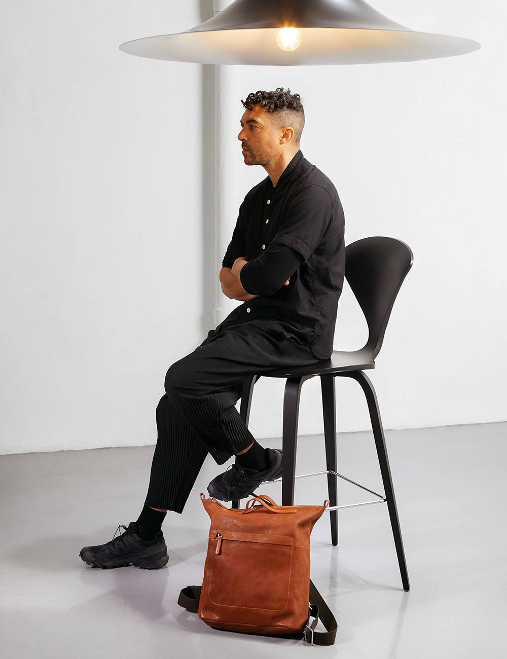 Marcus James with Ally Capellino Hoy Mini Leather Backpack in Redwood
